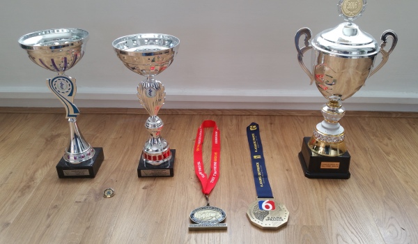 The rewards of my year.  From left to right: two cups and badge from Continental Centurions Race, Medal from GUCR, medal and cup from 6 day race